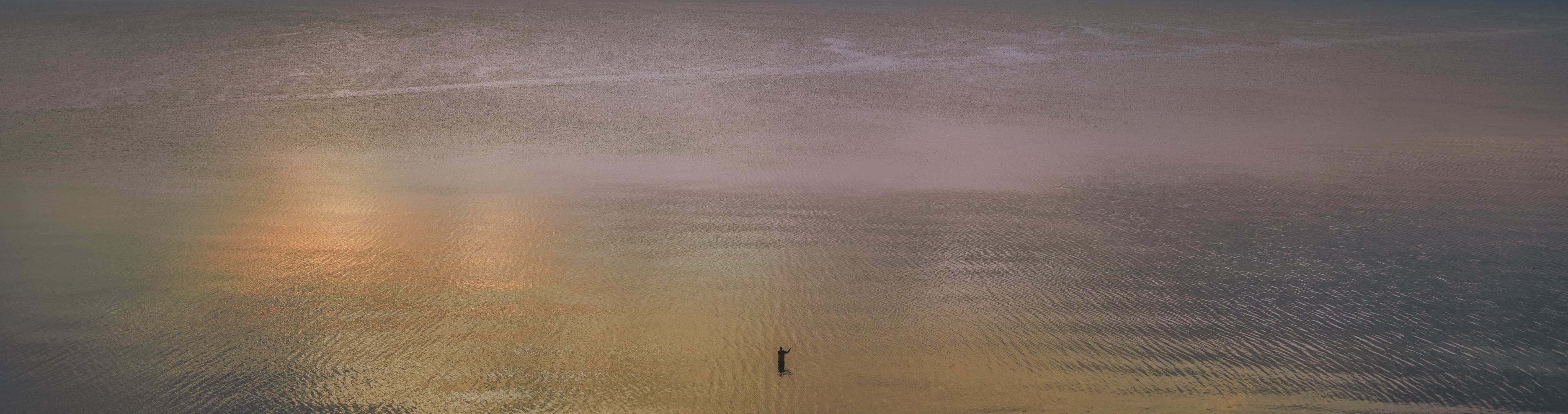 A lone fisherman during the 2019 COVID pandemic